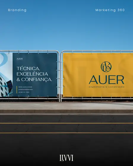 Tapume de obra com a identidade visual da AUER Engenharia e Construção, projeto de branding da Livvi